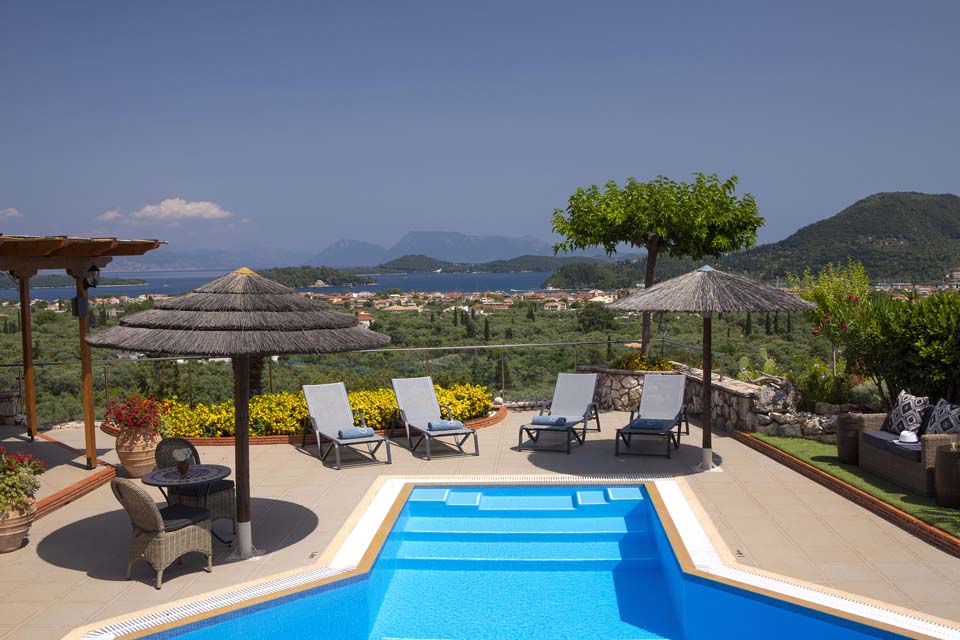 Villa Octavius pool, sun loungers and view to the Ionian Islands
