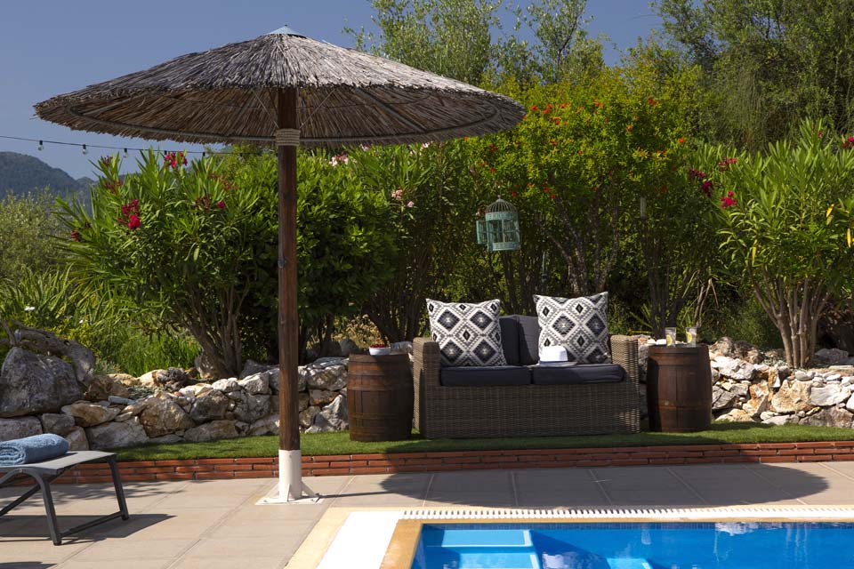 Poolside seating at Villa Octavius