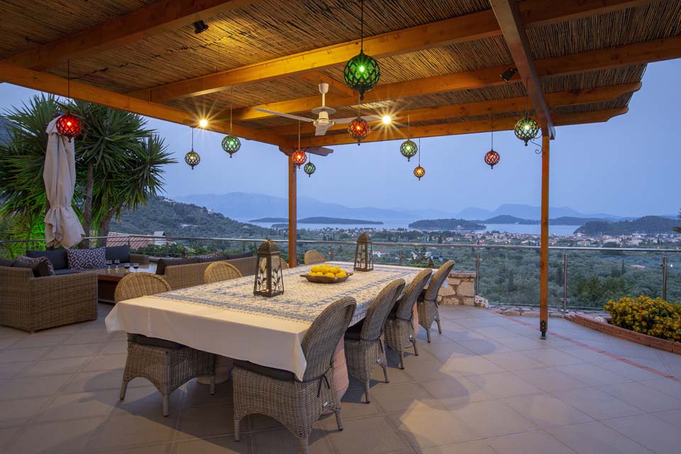 Outdoor dining at dusk at Villa Octavius