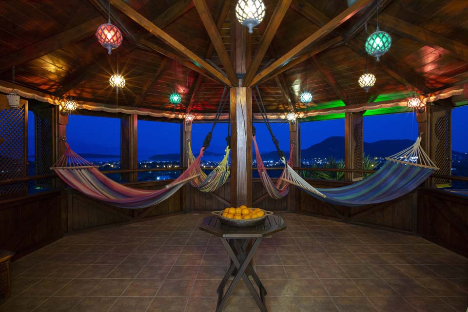 Octagonal Moroccan hammock tower at night at Villa Octavius