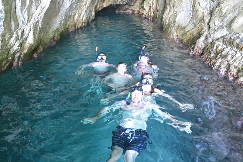 Guests in a cave on a Marine Adventure trip